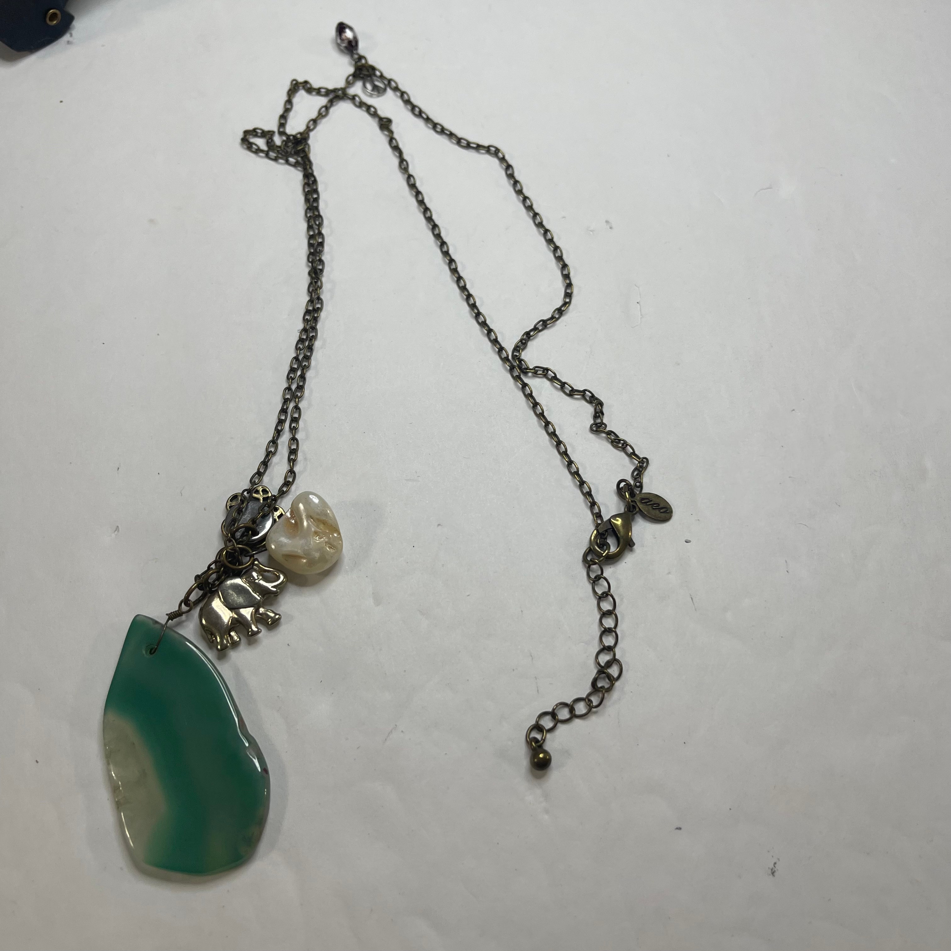 AEO necklace costume pendant necklace charm turquoise colored faux ...